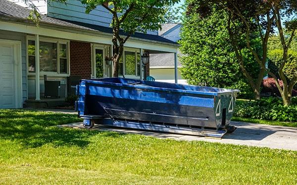 residential dumpsters can be placed on a driveway or yard, but safety measures must be required to avoid damage to the property